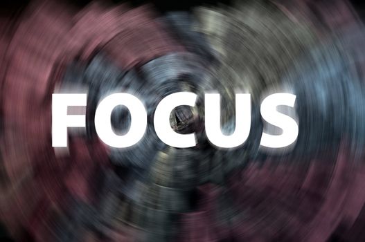 Focus word with motion rays on a blurred chalkboard background 