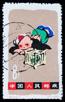 CHINA - CIRCA 1963: A stamp printed in China shows playing boy, circa 1963