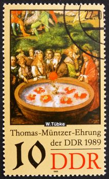 GDR - CIRCA 1989: a stamp printed in GDR shows Fountain, Detail of the Painting Early Bourgeois Revolution in Germany in 1525 by Werner Tubke, circa 1989