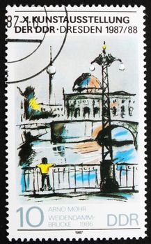 GDR - CIRCA 1987: a stamp printed in GDR shows Painting of Weidendamm Bridge by Arno Mohr, Berlin 1986, circa 1987