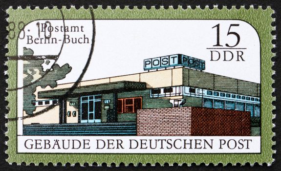 GDR - CIRCA 1988: a stamp printed in GDR shows Berlin-Buch Post Office, Postal Building, East Berlin, circa 1988