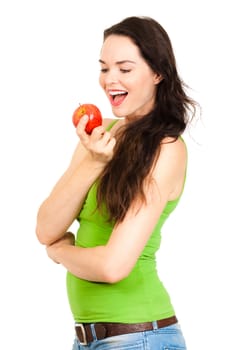 A beautiful young woman holding and looking at an apple. Isolated on white