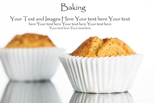 Close-up of a freshly home baked banana muffin on a reflective surface. Isolated on white.