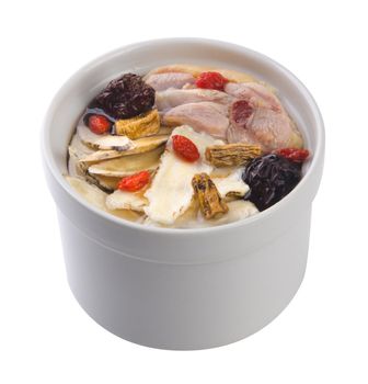 Chicken and herb soup in pot, Chinese food style.