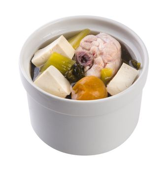 Chicken and herb soup in pot, Chinese food style.