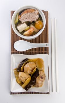 Chicken and herb soup in pot, Chinese food style.