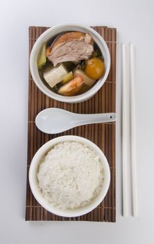 Chicken and herb soup in pot, Chinese food style.