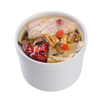Chicken and herb soup in pot, Chinese food style.