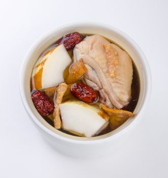 Chicken and herb soup in pot, Chinese food style.