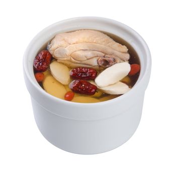 Chicken and herb soup in pot, Chinese food style.