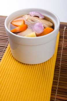 Chicken and herb soup in pot, Chinese food style.
