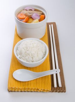 Chicken and herb soup in pot, Chinese food style.