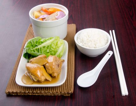 Chicken and herb soup in pot, Chinese food style.