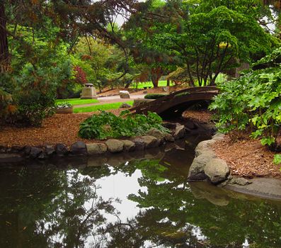 A photograph of an Asian style garden located at a public park.