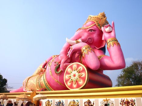 Big pink Ganesha in relaxed pose, From temple in Thailand