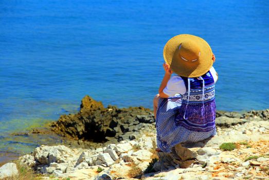 Lonely woman on the beach.