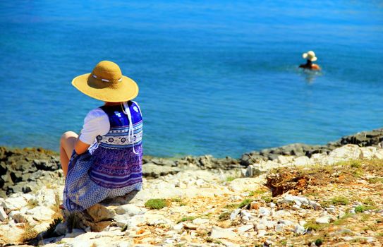 Sensitive woman on the summer beach.