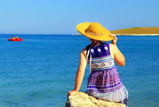 Sensitive woman on the summer beach.