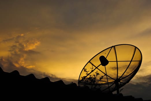 Satellite dish in morning sky