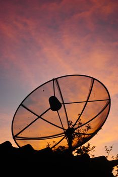 Satellite dish in morning sky