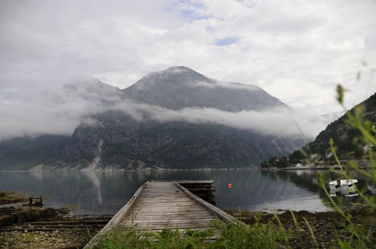 fog above the lake  of the quiet Norwegian bay