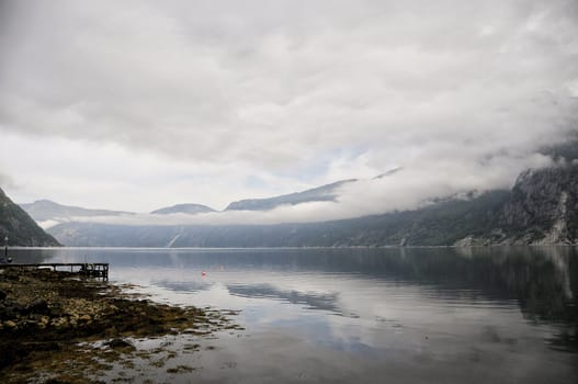 fog above the lake  of the quiet Norwegian bay