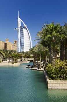 View at hotel Burj al Arab from Madinat Jumeirah in Dubai. Madinat Jumeirah encompasses two hotels and clusters of 29 traditional Arabic houses. United Arabe Emirates