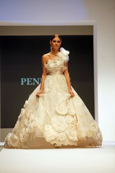 ZAGREB, CROATIA - FEBRUARY 19: Fashion model walks the runway in wedding dress on 'Wedding days' show, February 19, 2012 in Zagreb, Croatia.