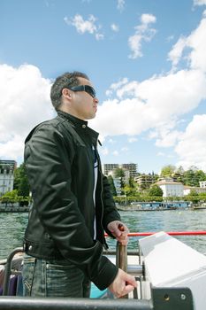 Man boating in Lugano Lake