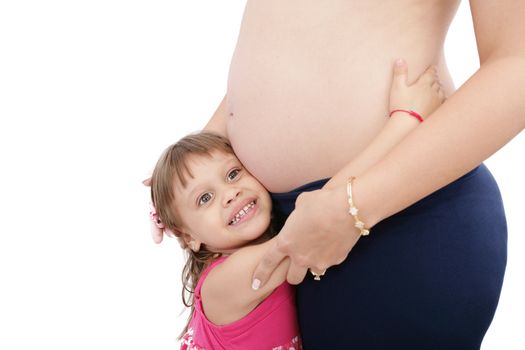 Pregnant mother with her small daughter studio shot