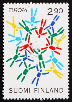 FINLAND - CIRCA 1995: a stamp printed in the Finland shows Stylized Parachutists, Peace and Liberty, circa 1995