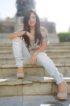 Young woman outdoors portrait. Soft sunny colors.