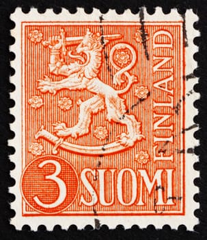 FINLAND - CIRCA 1954: a stamp printed in the Finland shows Crowned Lion Rampant, Arms of the Republic of Finland, circa 1954