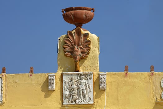 Sculptures on the roof of a house in a traditional Greek village of Zia. Kos Island, Greece