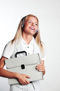 business woman in a headset on a gray background