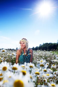  beautiful girl  in dress on the sunny daisy flowers field 