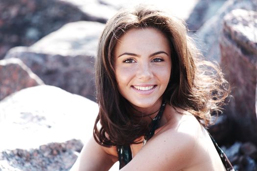  woman portrait on the sea stone