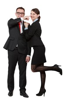 Young business couple having fun while posing against a white background.