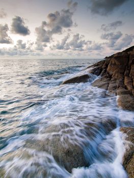 Beautiful seascape. Sea and rock at the sunset