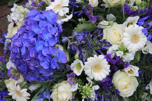 Mixed floral arrangement in white and blue