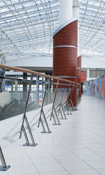 hall of modern office building with a glass handrail and a column