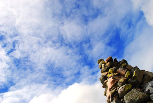 Cairn against blue sky.