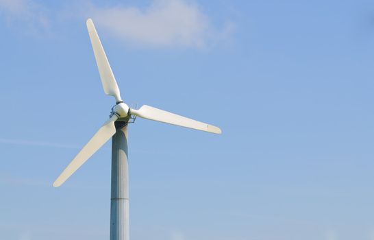 solitary wind turbine on a power generating farm in California, with room for your text