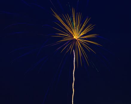 Brilliant colorful firework bursts at night