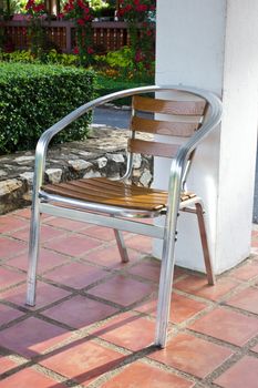 Stock Photo - metal garden chair in beautiful garden
