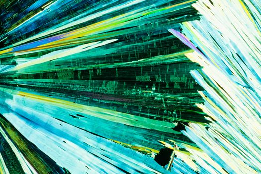 Colorful apearence of crystals of urea or carbamid, a powerful nitrogen fertilizer for agricultural use, in polarized light.
