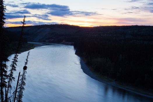 Tranquil midsummer night over wide Yukon River landscape, Yukon Territory, Canada