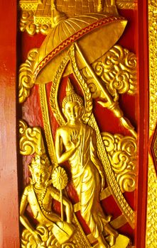 Stock Photo - Door wood carving art Angel, Ancient temple in the South of the country, Thailand