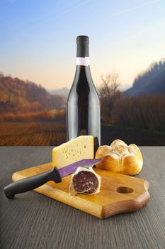 Table with sausage, cheese, bread and wine