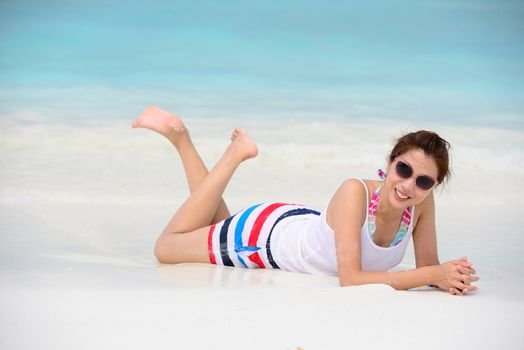 smiling beautiful woman lie on the beach for relaxation in summer lie on the beach for relaxation in summer
